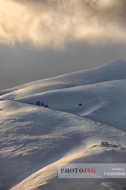 Fairytale atmosphere on a winter afternoon in Castelluccio di Norcia, Sibillini national park, Umbria, Italy, Europe