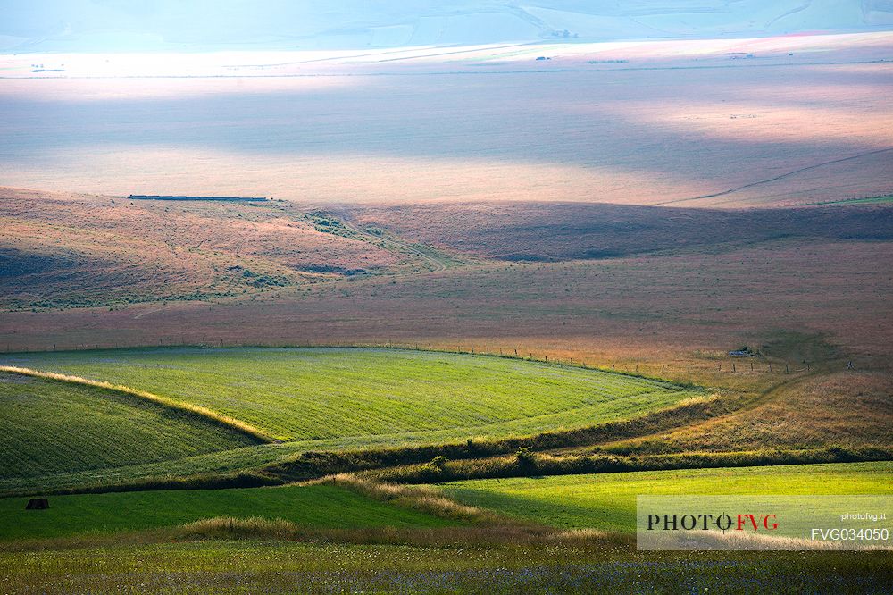 Lights and shadows in Pian Grande of  Castelluccio di Norcia, Sibillini National park, Umbria, Italy, Europe