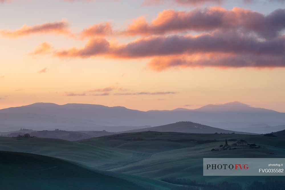 The beauty of the hills in Val d'Orcia, ridges and farmhouses typical of Tuscan beauties