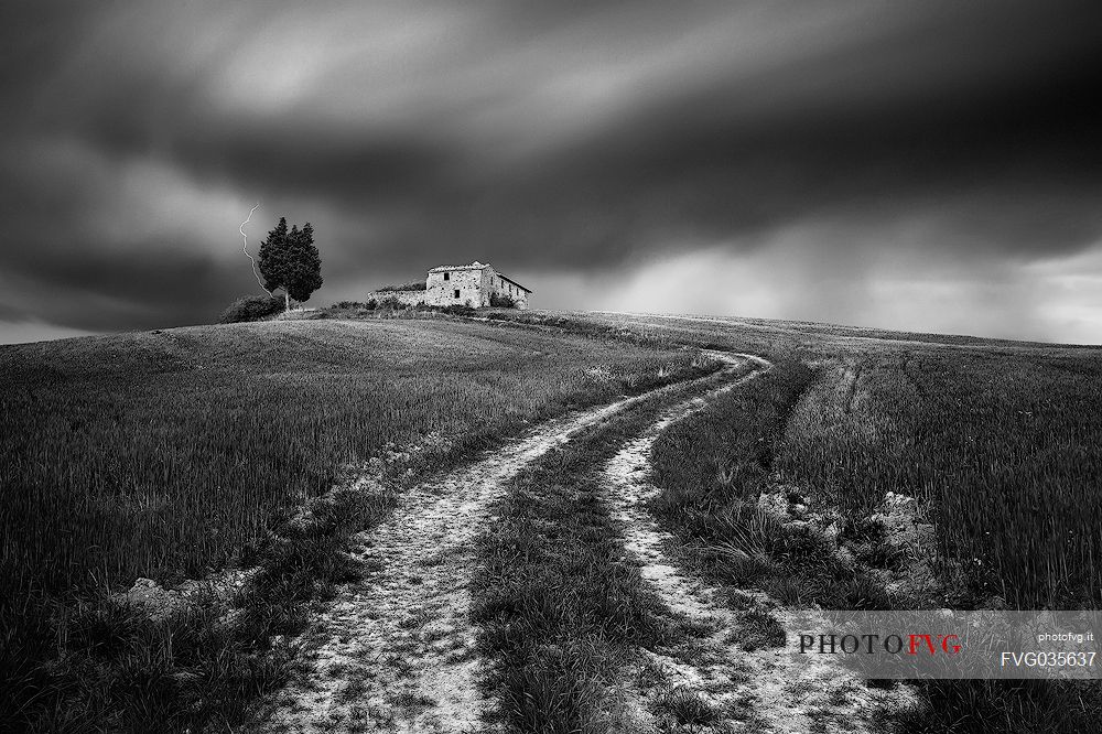 Thunderstorm over the old farmhouse in the Orcia valley, Tuscany, Italy, Europe