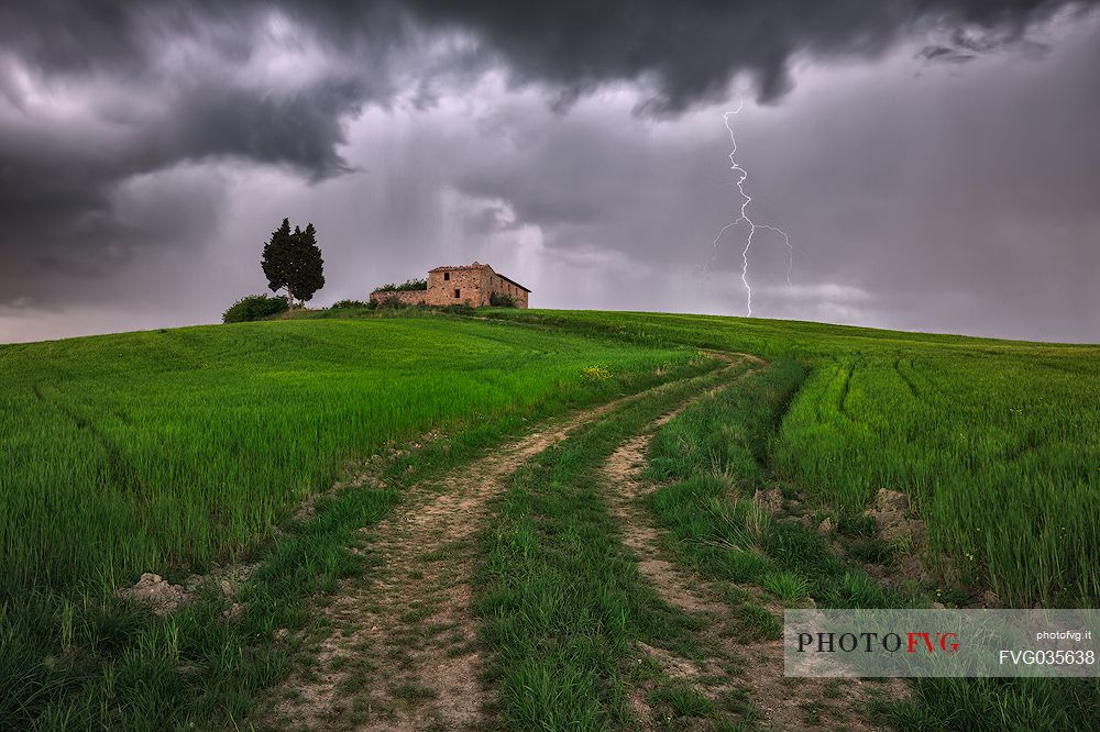 Thunderstorm over the old farmhouse in the Orcia valley, Tuscany, Italy, Europe