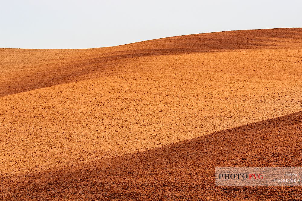 Plowed fields in the hills of the Val d'Orcia, Tuscany, Italy, Europe