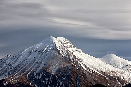 A clearing snowstorm reveal the peaks of the Gran Sasso mountain range, Gran Sasso and monti della Laga national park, Abruzzo, Italy A clearing snowstorm reveal the peaks of the Gran Sasso mountain range, Gran Sasso and monti della Laga national park, Abruzzo, Italy