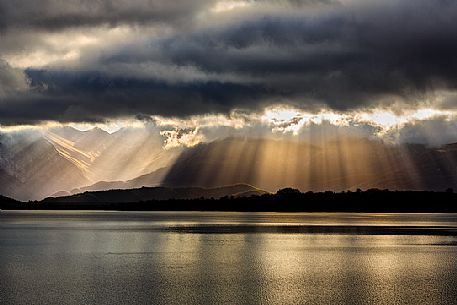 A wonderful light over lake of Campotosto during an amazing sunrise, Gran Sasso and Monti della Laga national park, Abruzzo, Italy