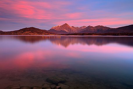 The lake of Campotosto at sunset, Gran Sasso e Monti della Laga national park, Abruzzo, Italy