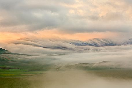 An immense expanse of fog that embraces Plain of Castelluccio di Norcia, Sibillini national park, Umbria, Italy, Europe