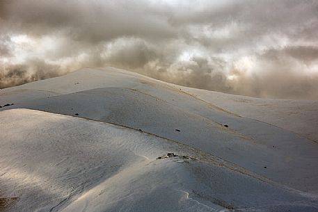 Winter landscape along the road to Forca di Presta mountain pass, Sibillini national park, Umbria and Marches, Italy, Europe Winter landscape along the road to Forca di Presta mountain pass, Sibillini national park, Umbria and Marches, Italy, Europe