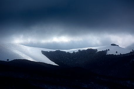 Dramatic sky over the woods near Castelluccio di Norcia, Sibillini National park, Umbria, Italy, Europe