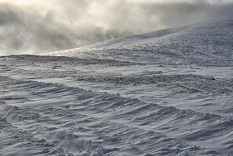 The access from Forca di Presta to Castellucciio di Norcia in winter, Sibillini national park, Umbria and Marches, Italy, Europe The access from Forca di Presta to Castellucciio di Norcia in winter, Sibillini national park, Umbria and Marches, Italy, Europe