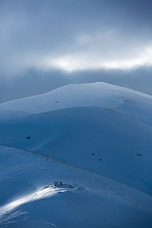 Fairytale atmosphere on a winter afternoon in Castelluccio di Norcia, Sibillini national park, Umbria, Italy, Europe