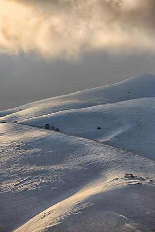 Fairytale atmosphere on a winter afternoon in Castelluccio di Norcia, Sibillini national park, Umbria, Italy, Europe