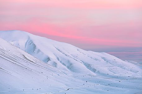 A sunset with soft pastel pink colors in Castelluccio, Sibillini National Park, Umbria, Italy, Europe