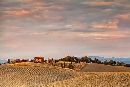 The beauty of the hills in Val d'Orcia, ridges and farmhouses typical of Tuscan beauties, Pienza, Tuscany, Italy, Europe The beauty of the hills in Val d'Orcia, ridges and farmhouses typical of Tuscan beauties, Pienza, Tuscany, Italy, Europe