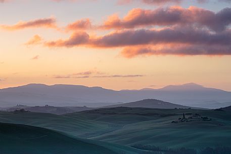 The beauty of the hills in Val d'Orcia, ridges and farmhouses typical of Tuscan beauties