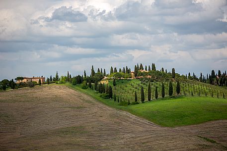 The beauty of the hills in Val d'Orcia, ridges and farmhouses typical of Tuscan beauties, Pienza, Orcia valley, Tuscany, Italy, Europe