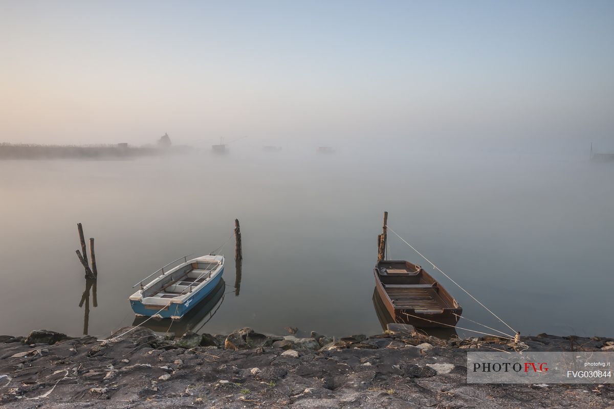 Rowing Boats in the coast of Comacchio lagoon, Emilia Romagna, Italy