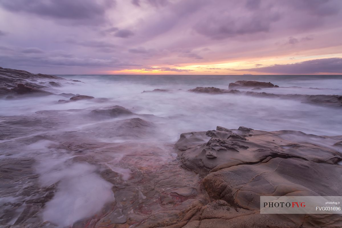 Sea rocks at twilight, Calafuria, Livorno, Tuscany, Italy