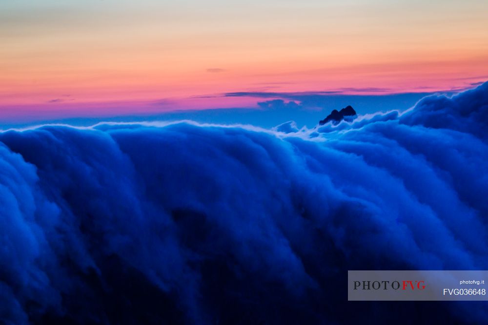 Fall of clouds at sunset in the Apuane alps, Penna di Sumbra mount, Tuscany, Italy, Europe