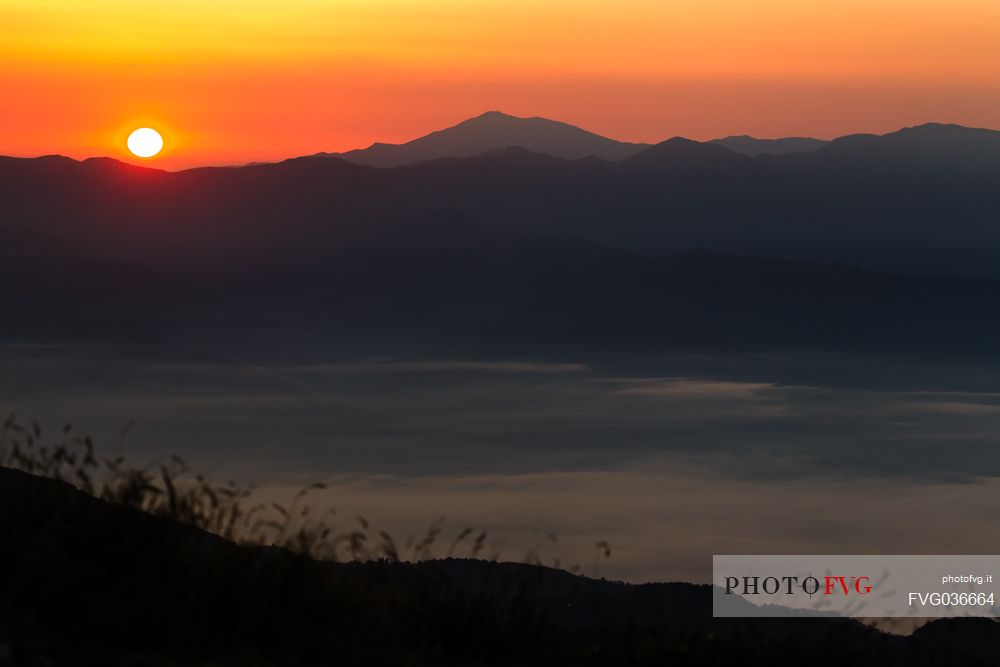 Red sunrise on Apuane alps, Penna di Sumbra mount, Tuscany, Italy, Europe