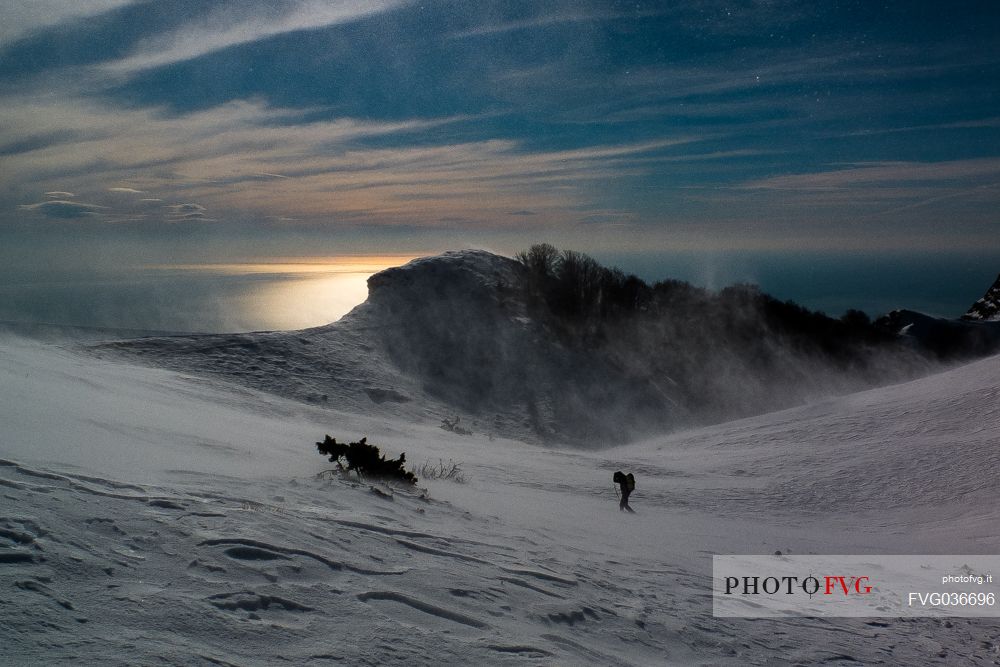 Man in the blizzard in the Apuane Alps, Sagro mount, Tuscany, Italy, Europe