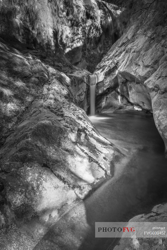 The water tells. Scrolling and playing on the rock. Erosion that gives birth spectacles of nature, Orvenco river, Friuli Venezia Giulia, Italy, Europe