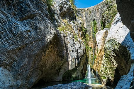 Emerald reflections in the gorge of the Torre creek, in the background the Malignani dam, Tarcento, Friuli Venezia Giulia, Italy, Europe Emerald reflections in the gorge of the Torre creek, in the background the Malignani dam, Tarcento, Friuli Venezia Giulia, Italy, Europe