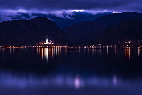 Bled lake with the church of Assumption, Marijino vnebovzetje, on the islet by night, Slovenia, Europe Bled lake with the church of Assumption, Marijino vnebovzetje, on the islet by night, Slovenia, Europe