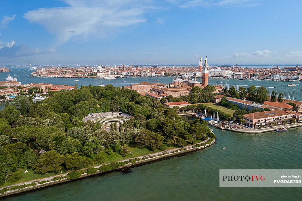 Shot from above of the island of San Giorgio, in the foreground the Green Theater, in the background San Marco and all its basin