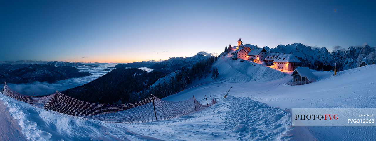 A very cold and clear sunrise from the top of Mount Lussari, a 1789 m. mountain of the Julian Alps that owes its fame mainly to the convent built in the sixteenth century on top of it. A very cold and clear sunrise from the top of Mount Lussari, a 1789 m. mountain of the Julian Alps that owes its fame mainly to the convent built in the sixteenth century on top of it.