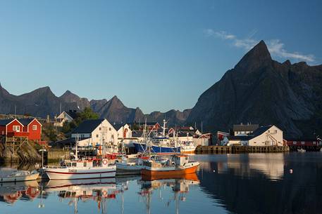 The Lofoten Mountains overlooking the harbor Hamnoya