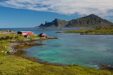 the homes of Norwegian fishermen overlook the turquoise sea