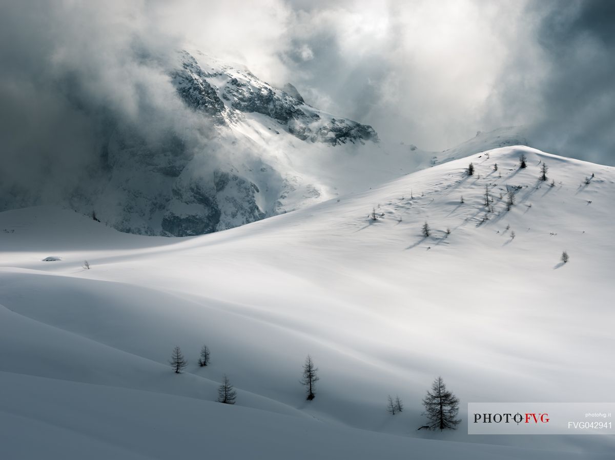 Thunder clouds over the Giau pass creating lights and shadow shapes, Cortina d'Ampezzo, dolomites, Veneto, Italy