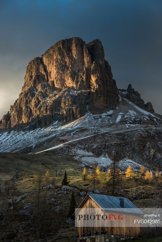 Sunset on Mount Averau and on a small hut below, Giau pass, dolomites, Cortina d'Ampezzo, Veneto, Italy, Europe