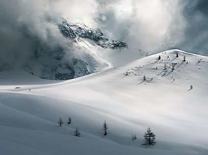 Thunder clouds over the Giau pass creating lights and shadow shapes, Cortina d'Ampezzo, dolomites, Veneto, Italy Thunder clouds over the Giau pass creating lights and shadow shapes, Cortina d'Ampezzo, dolomites, Veneto, Italy