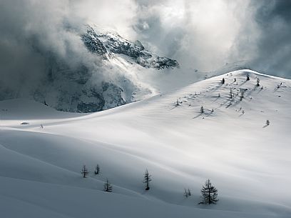 Thunder clouds over the Giau pass creating lights and shadow shapes, Cortina d'Ampezzo, dolomites, Veneto, Italy