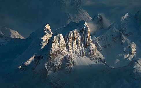 Detail of the Averau and Nuvolau mountains illuminated by the sun after a heavy snowfall, View from the Lagazuoi refuge, dolomites, Cortina d'Ampezzo, Veneto