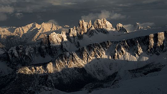 Overview of the Croda da Lago and Lastoi de Formin mountains illuminated by the sun after a heavy snowfall, view from the Lagazuoi refuge, Falzarego, Cortina d'Ampezzo, dolomites, Italy, Europpe