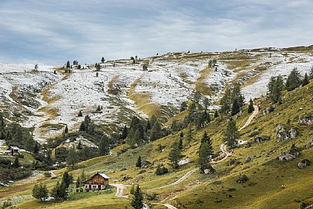 Meadows of the Giau pass partly covered by a dusting of snow, dolomites, Cortina d'Ampezzo, Veneto, Italy Meadows of the Giau pass partly covered by a dusting of snow, dolomites, Cortina d'Ampezzo, Veneto, Italy