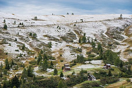 Meadows of the Giau pass partly covered by a dusting of snow, dolomites, Cortina d'Ampezzo, Veneto, Italy