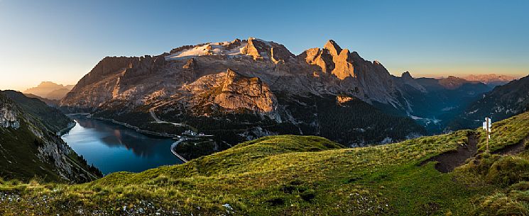 Summer view of the Marmolada and Fedaia lake at dawn, Trentino Alto Adige, Italy, Europe