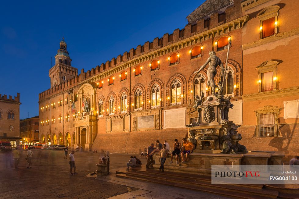 The Neptune fountain and d'Accursio palace, municipal building of Bologna The Neptune fountain and d'Accursio palace, municipal building of Bologna