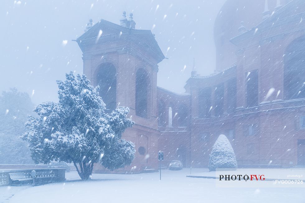 A winter view of one detail of San Luca church during a snowfall