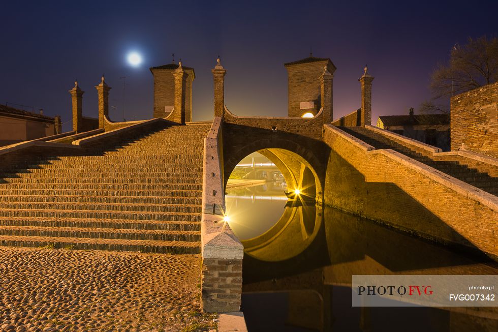 Night view of Tre Ponti bridge in the moonlight
