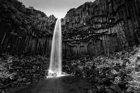 A darkness view of the Svartifoss waterfall in a Skaftafell National Park