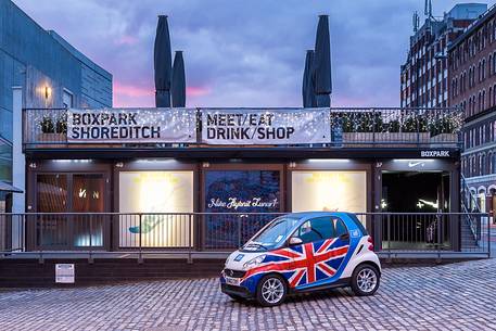 A Smart automobile with english flag in front of one Nike shop in borough of Shoreditch