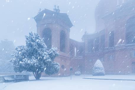 A winter view of one detail of San Luca church during a snowfall