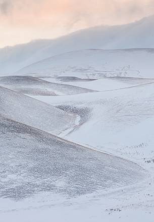 Graphisms of Piano Grande's hills after a snowfall during the sunrise