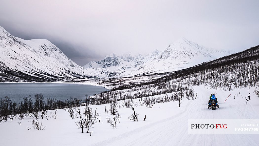 Snowmobile trip in the Lyngen Alps, Troms, Norway, Europe 
