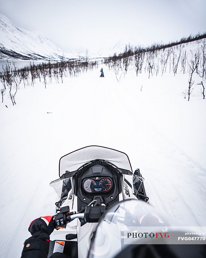 Snowmobile trip in the Lyngen Alps, Troms, Norway, Europe 
