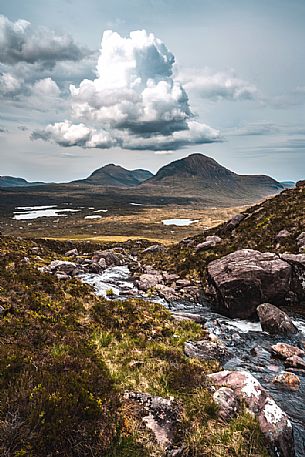 The river born from a glacier lake up the mountain in the Beinn Eighe national nature reserve, Torridon, Highlands, Scottish, United Kingdom The river born from a glacier lake up the mountain in the Beinn Eighe national nature reserve, Torridon, Highlands, Scottish, United Kingdom